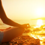 Hand Of Woman Meditating In A Yoga Pose On Beach